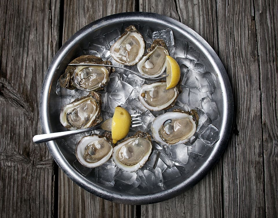 Where Have All the Oysters Gone? 4 A classic plate of raw oysters served on ice with lemons at Boss Oyster House. (Photo by Jeremiah Stanley)