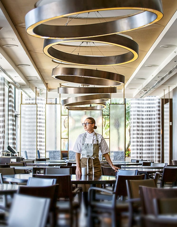 Adrienne Grenier enjoys a calm moment at 3030 Ocean before the food and guest prep starts; Photograph by Jessie Prezza