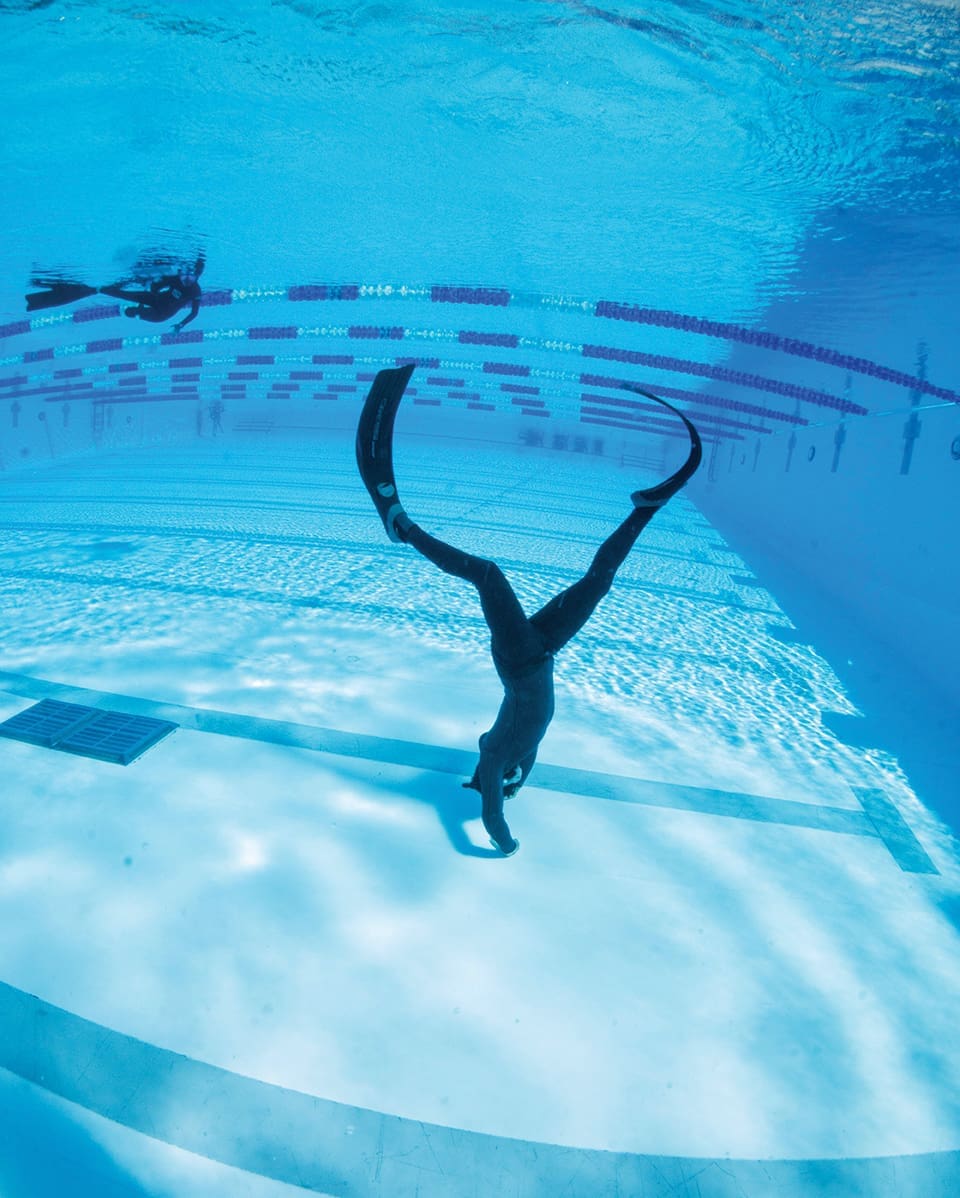 Freediving students learn kick cycles to conserve energy and wear long, light fins for greater efficiency. Photograph by Performance Freediving