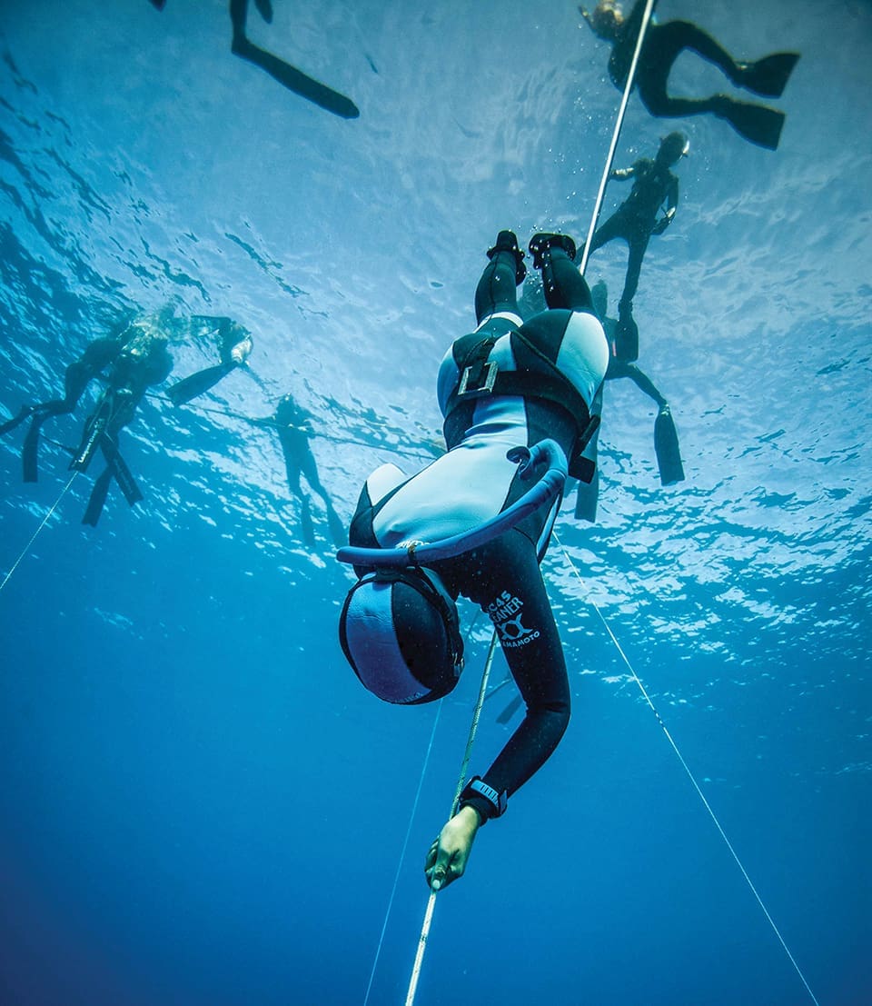 Freedivers drop weighted ropes to mark depth and to orient themselves underwater. Photograph by Performance Freediving