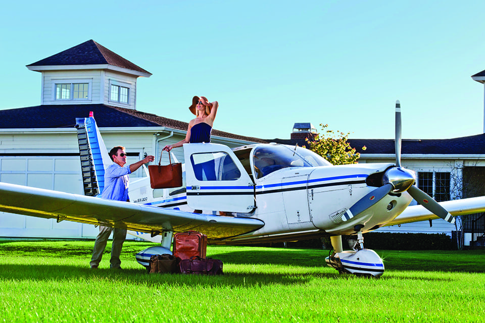 Sky’s the Limit in a Small-Craft Airplane 4 Christina and Jamie Clifford disembark a 1974 PA32 Piper Cherokee Six, at Grass Roots Airpark in Groveland. Photograph by Jeremiah Stanley