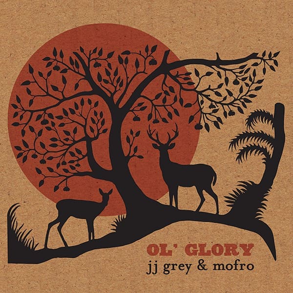 Album cover. A paper bag-like background features a red moon covered by a silhouette off deers and trees. It says OL'GLORY in the bottom right corner. Underneath, in lowercase text, it reads "jj grey & mofro."