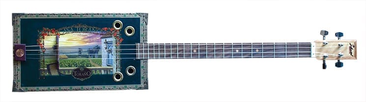 A more ornate cigar box with four strings. Photography by Vinnie Zullo