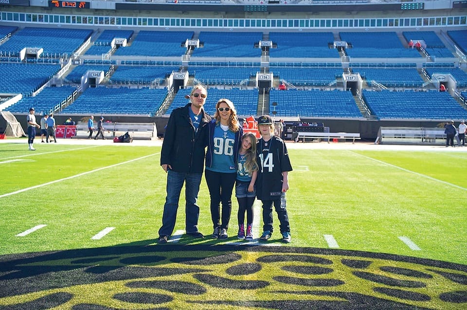 Power House: At Home with the Tedeschi Trucks Band 4 The singers pose with their children after a Jaguars game. Photography by Tedeschi Trucks Band