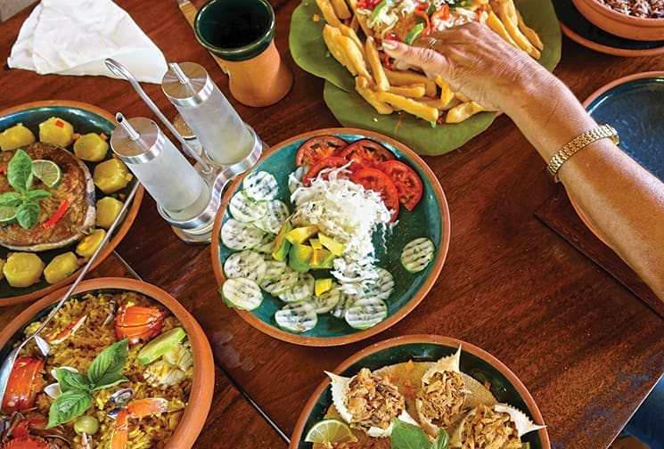 Digging into lunch at La Cueva Taina in Gibara; Photography by Terry Ward