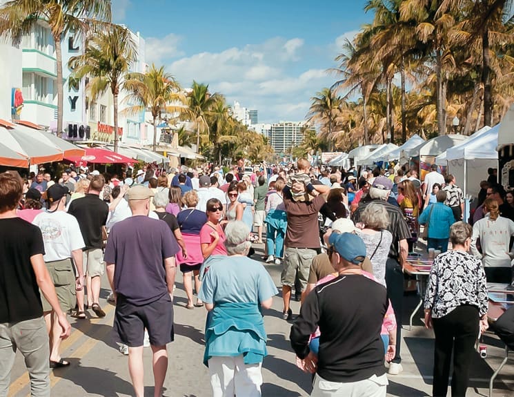 Crowds meander down Collins Avenue during Art Deco Weekend; Photography by Miami Design Preservation League