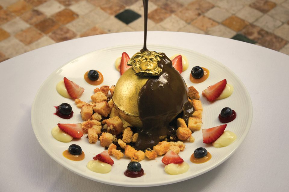 A dessert from the Villa Casa Casuarina restaurant is drizzled with chocolate.