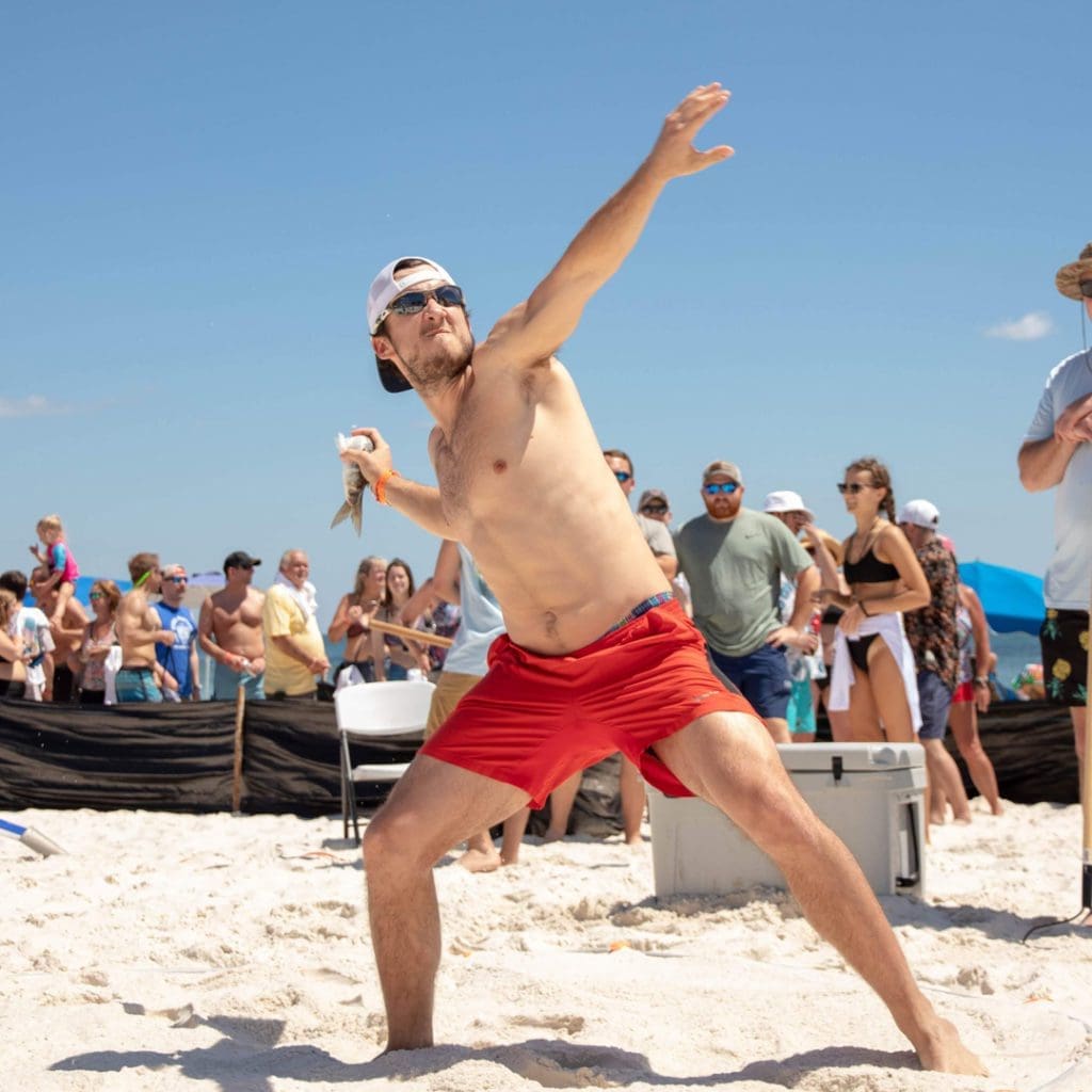 23 Events Around the Sunshine State You Won't Want to Miss This Spring 3 Man in a bathing suit throwing a mullet