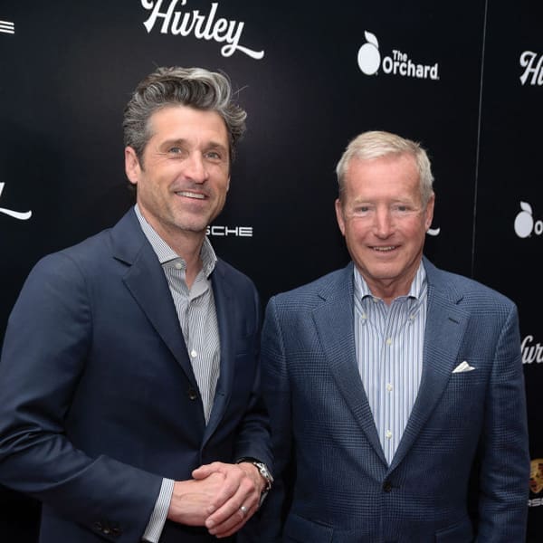 Racing Icon Hurley Haywood Gets Real About His Personal Life & Career 7 Dempsey and Haywood (right) both wear a variation of blue suits and striped button down shirts.
