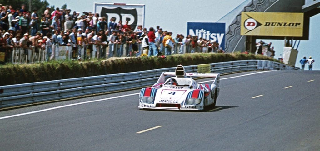 Racing Icon Hurley Haywood Gets Real About His Personal Life & Career 12 A crowd looks on as Haywood races by.