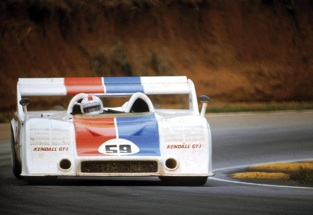 Racing Icon Hurley Haywood Gets Real About His Personal Life & Career 8 Haywood behind the wheel of a 917-10 Porsche Spyder, a low, boxy car. It is white with a blue and red stripe.