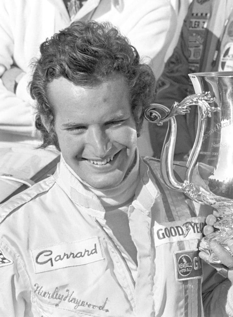 Racing Icon Hurley Haywood Gets Real About His Personal Life & Career 4 Haywood smiles with his trophy.