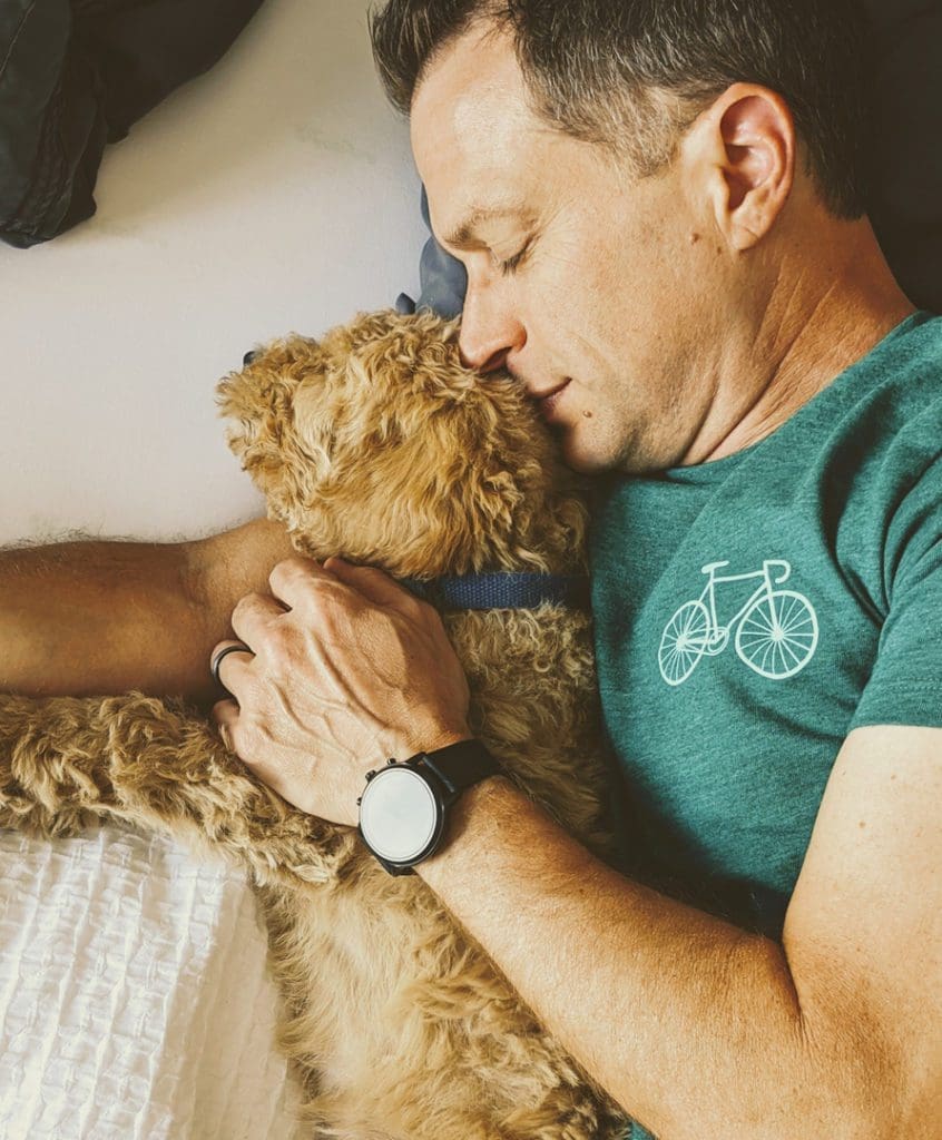 What I Learned From Road Tripping (With a Puppy) During a Pandemic 2 Eric snuggles with Finn