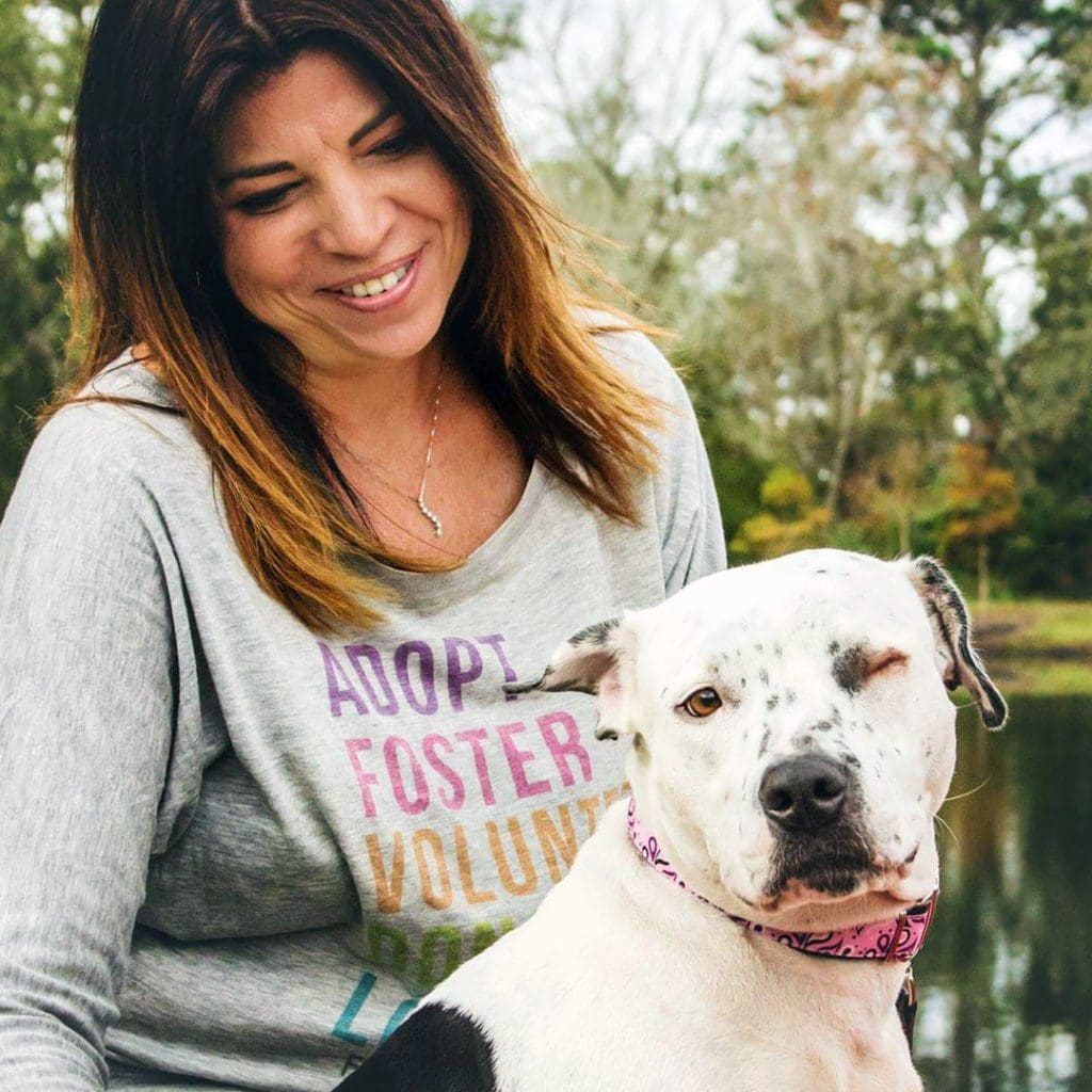 Kelly with a rescue dog. Courtesy of Woof Creative Photography.web