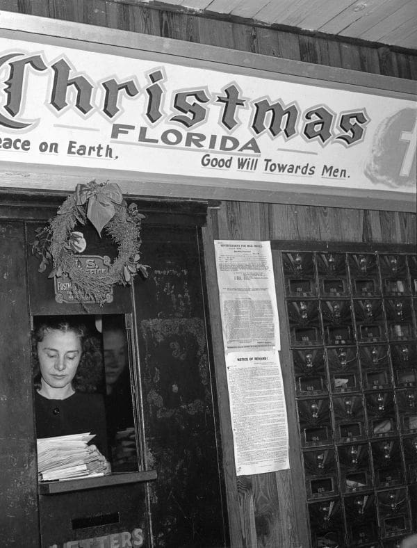 Juanita Tucker sorts letters to santa 1947