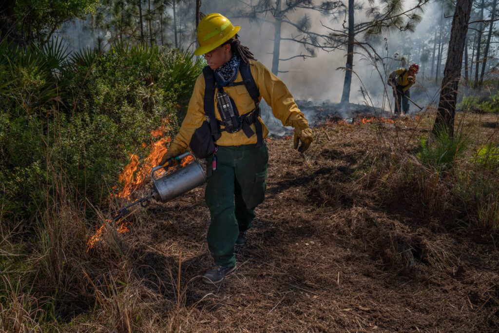 A female fire crew works at the Disney Wilderness Preserve.