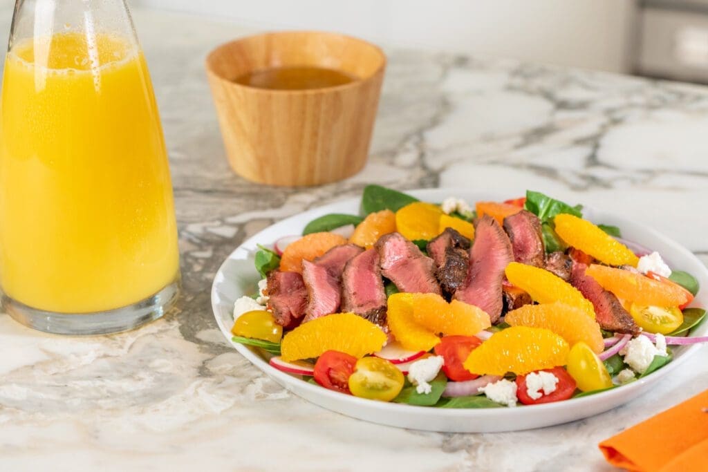 Why Florida Citrus Is the Sunshine State’s Treasure 2 A steak salad with fresh Florida citrus, tomatoes and radishes.