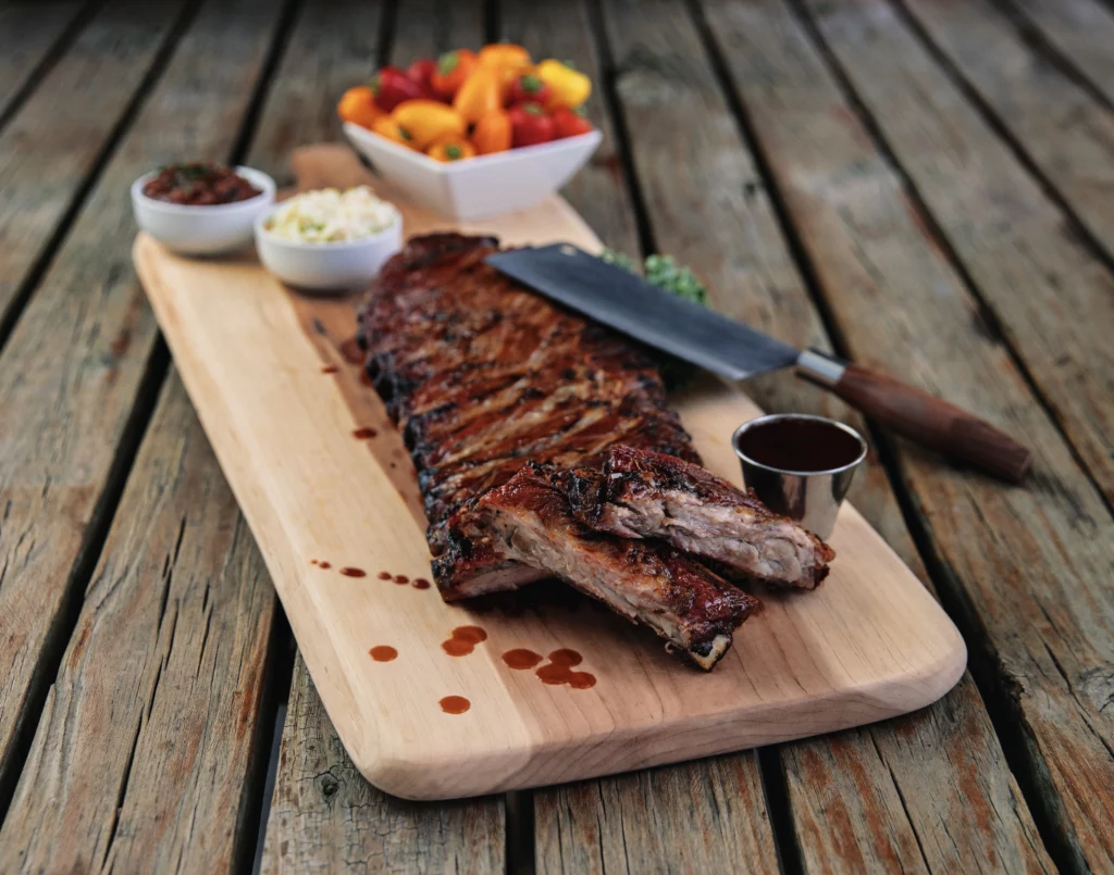 Peebles Bar-B-Q serves delicious ribs, pictured here on a wood cutting board.