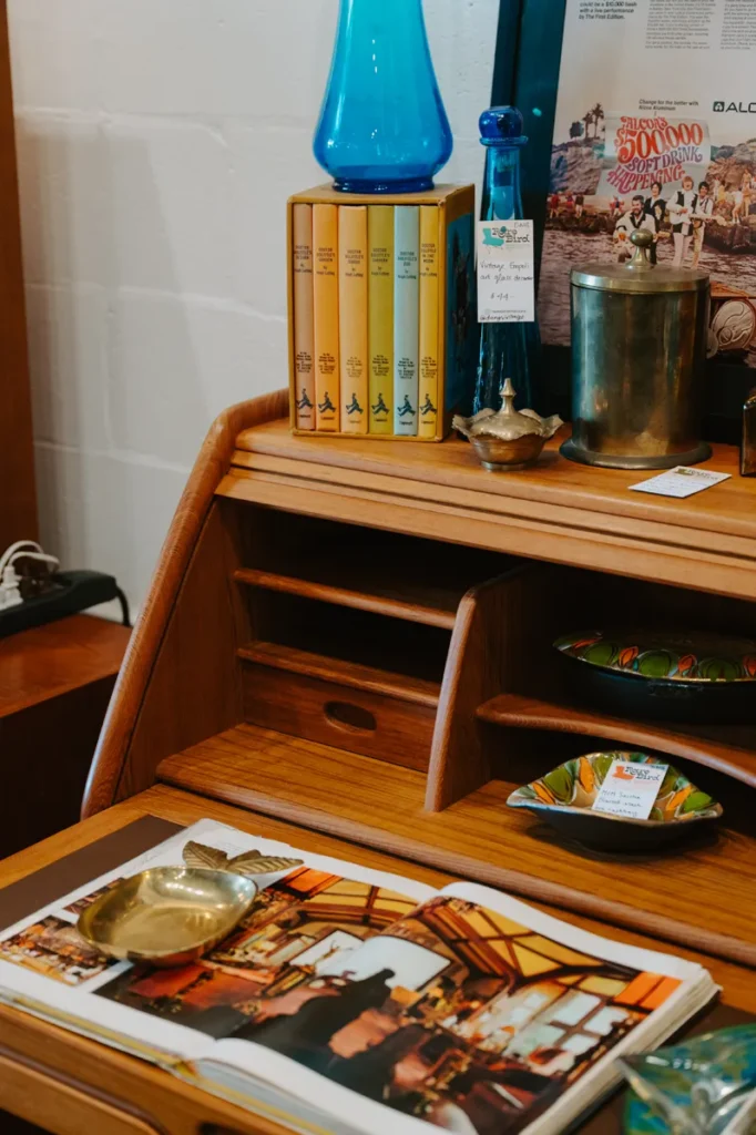 Vintage desk with bowls and books.