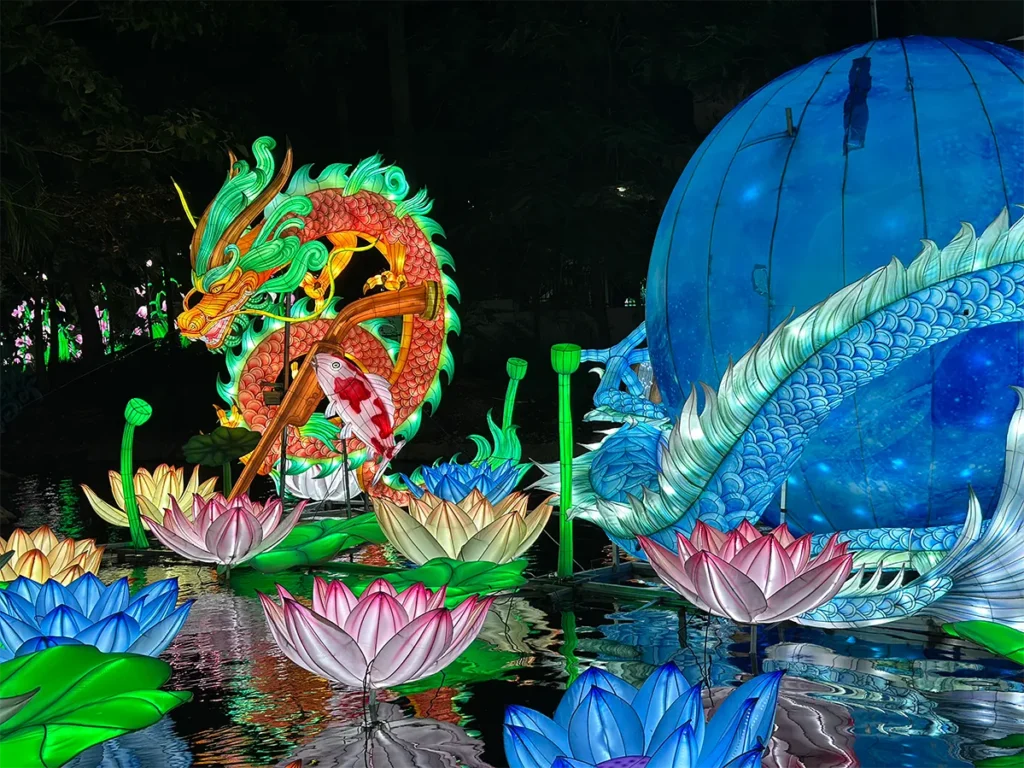 A dragon and lotus flower lighting display.