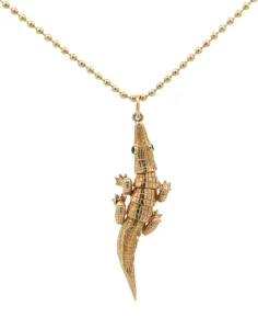 The Homegrown Holiday Edit: 2025 Gift Guide 14 A golden necklace from Lyman Fine Jewelry, featuring an alligator charm.