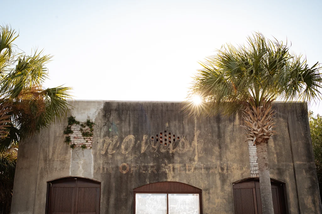 Why Florida's Forgotten Coast Wants You to Forget All About It 2 The sun peaks over Apalachicola building. Part of Florida's Forgotten Coast.